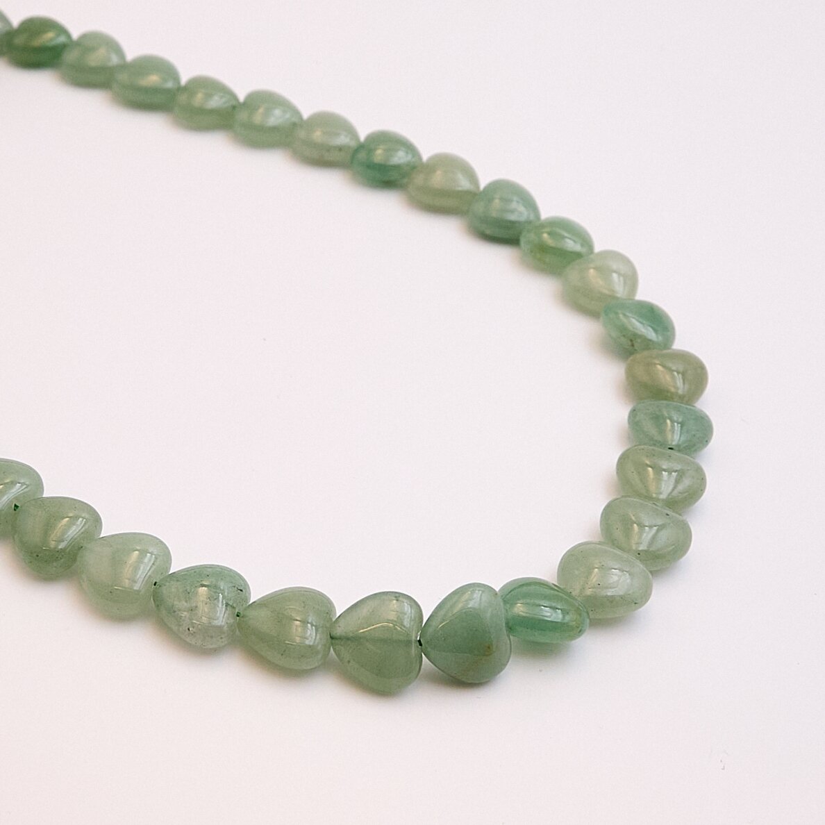 Aventurine, Natural, AB quality, curved heart shape, 39–40 cm/strand, 6 mm Aventurine, Natural, AB quality, curved heart shape, 39–40 cm/strand, 6 mm