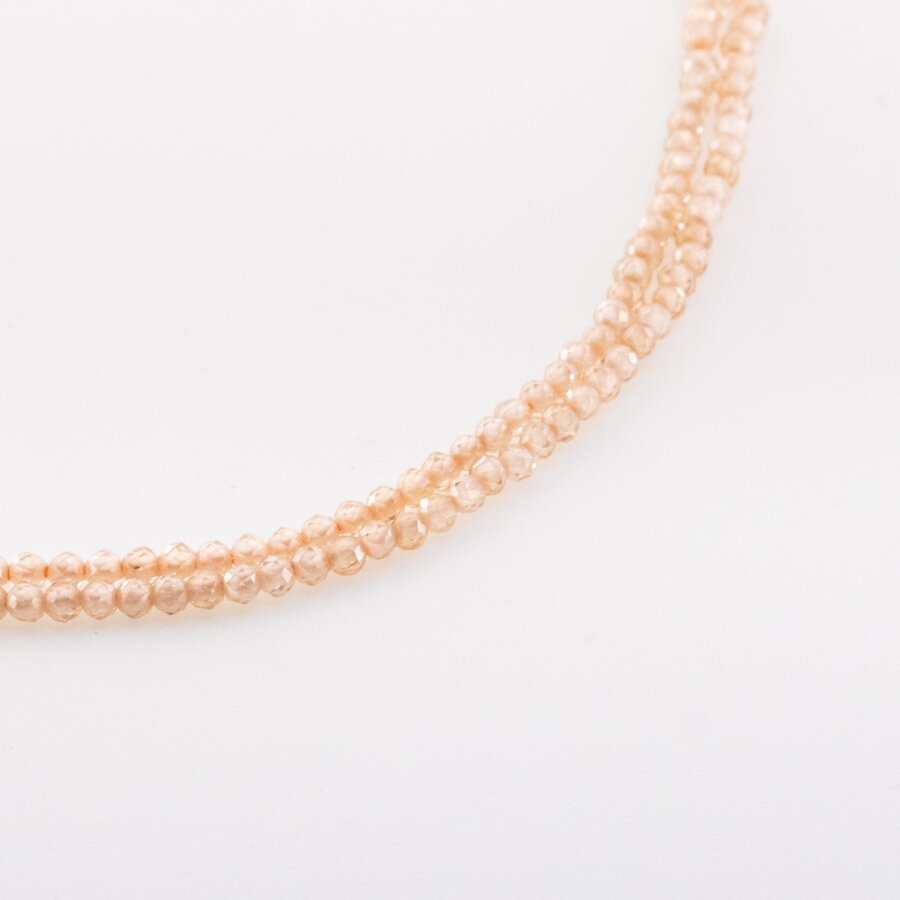 Cirkonis, briaunuotas, apvali forma, šampano aukso spalva, 37-39 cm/gija, 2, 3 mm Cirkonis, briaunuotas, apvali forma, šampano aukso spalva, 37-39 cm/gija, 2, 3 mm