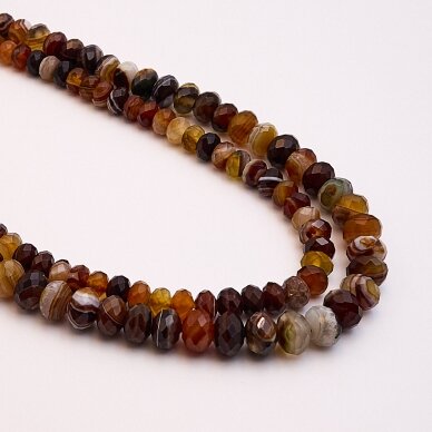 Dryžuotas agatas, natūralus, A kokybė, dažytas, briaunuotas, rondelės forma, 37-39 cm/gija, 6x10 mm Dryžuotas agatas, natūralus, A kokybė, dažytas, briaunuotas, rondelės forma, 37-39 cm/gija, 6x10 mm