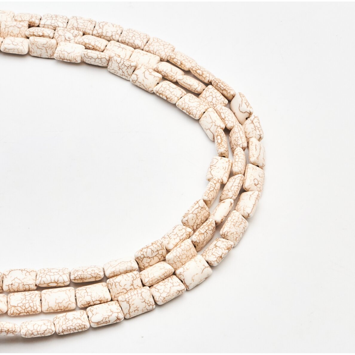 Hovlitas, imitacija, išgaubto stačiakampio forma, smėlio spalva, 37-39 cm/gija, 10x16 mm Hovlitas, imitacija, išgaubto stačiakampio forma, smėlio spalva, 37-39 cm/gija, 10x16 mm