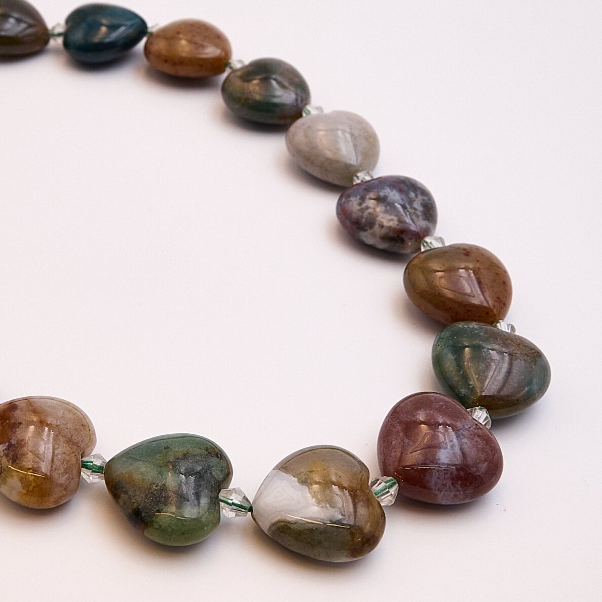 IndiaAgate, Natural, AB quality, curved heart shape, 39–40 cm/strand, 15 mm IndiaAgate, Natural, AB quality, curved heart shape, 39–40 cm/strand, 15 mm