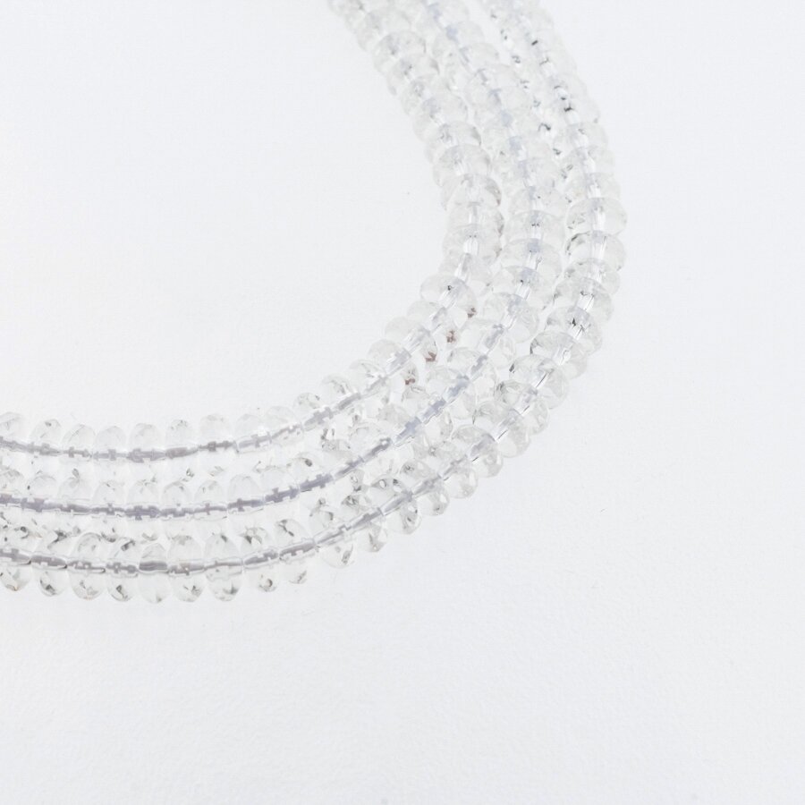 Kalnų krištolas, regeneruotas sintetinis, briaunuotas, abacus rondelės forma, skaidri balta spalva, 37-39 cm/gija, 6x4 mm Kalnų krištolas, regeneruotas sintetinis, briaunuotas, abacus rondelės forma, skaidri balta spalva, 37-39 cm/gija, 6x4 mm