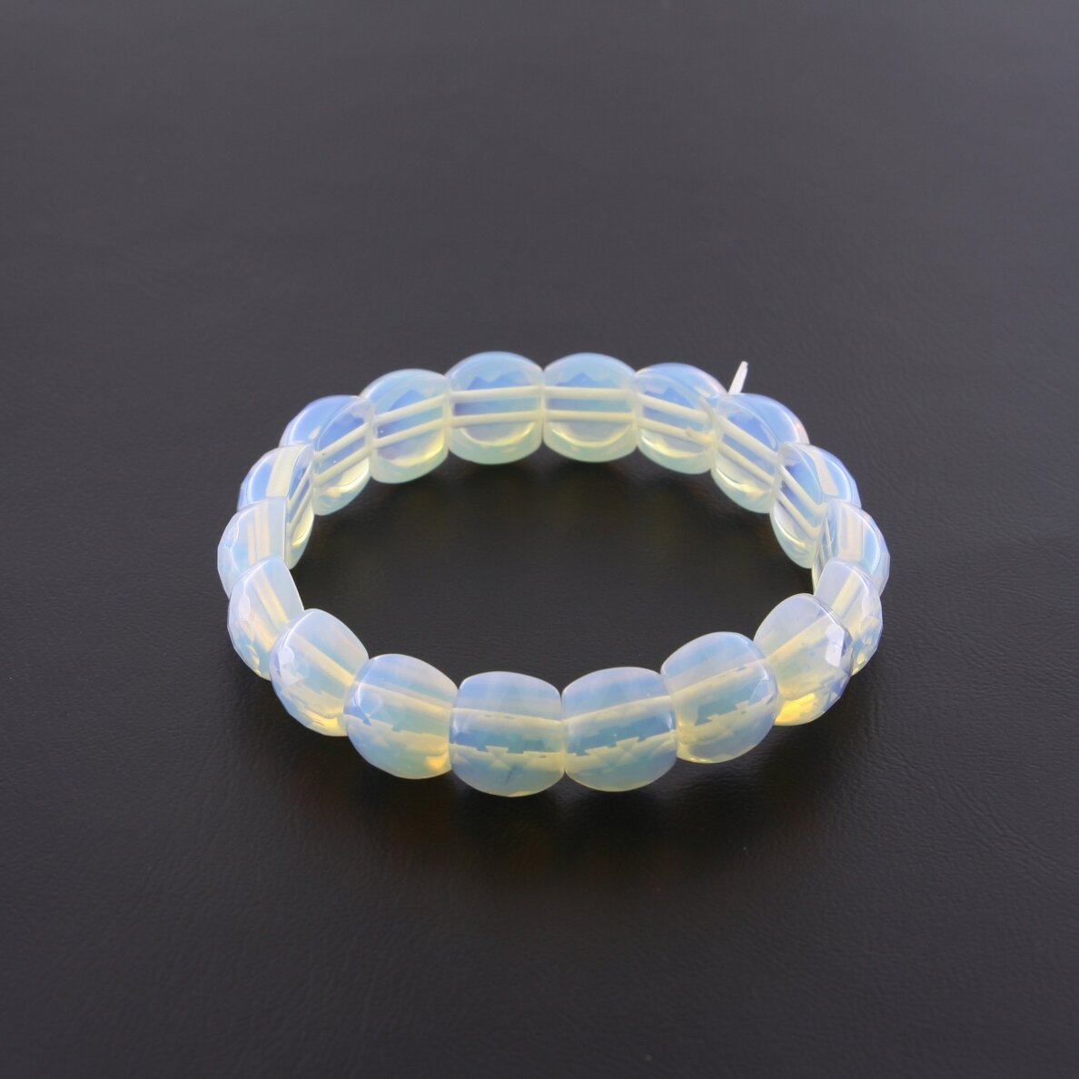 Opalite stone bracelet, faceted halfround form, 21cm long, 13x11mm size