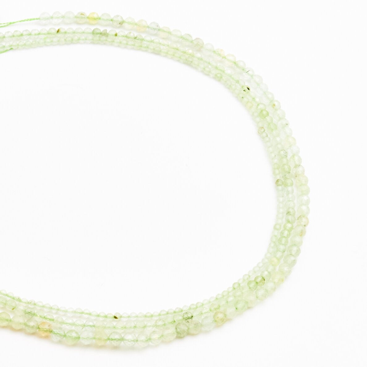 Prehnite, natural, B quality, faceted, round bead, 37-39 cm/string, 3 mm Prehnite, natural, B quality, faceted, round bead, 37-39 cm/string, 3 mm