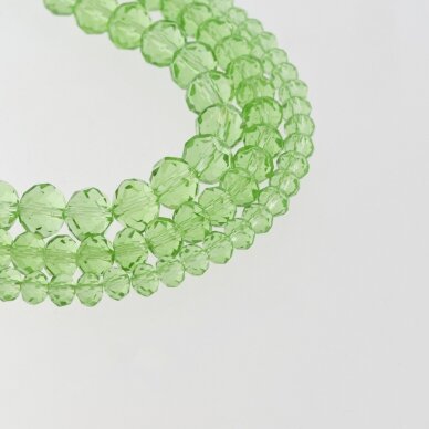Stikliniai kristalai, briaunuoti, rondelės forma, #023 skaidri šviesiai žalia spalva, apie 90-95 vnt./gija, 2x1, 3x2, 4x3, 6x4, 8x6, 10x8, 11x9 mm