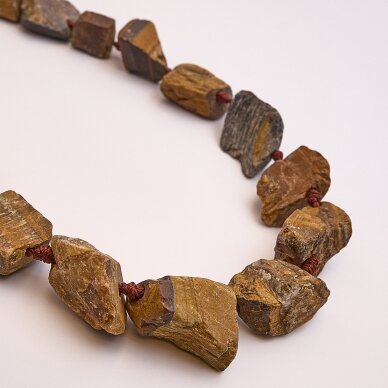 Tigro akis, natūralus, B kokybė, gabaliuko forma, matinis, , ruda spalva, 37-39 cm/gija, 14x19x12-20x28x14 mm Tigro akis, natūralus, B kokybė, gabaliuko forma, matinis, , ruda spalva, 37-39 cm/gija, 14x19x12-20x28x14 mm