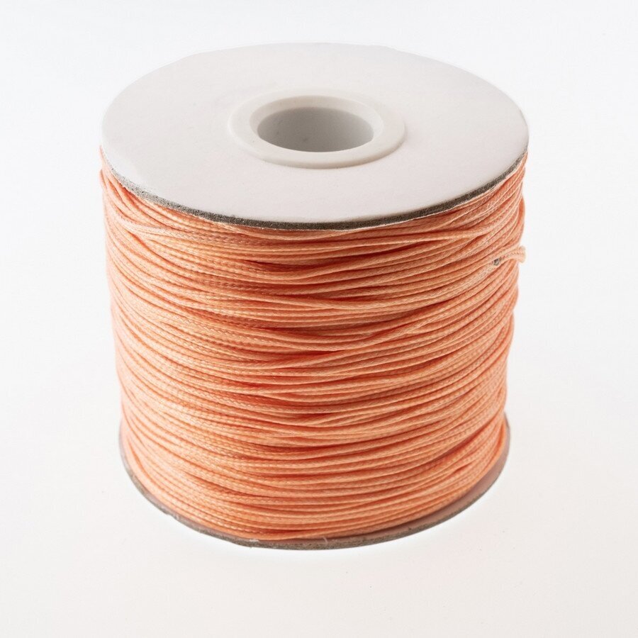 Vaškuota poliesterinė virvelė, #15 lašišų spalva, apie 180 metrų/ritė, 0.8 mm